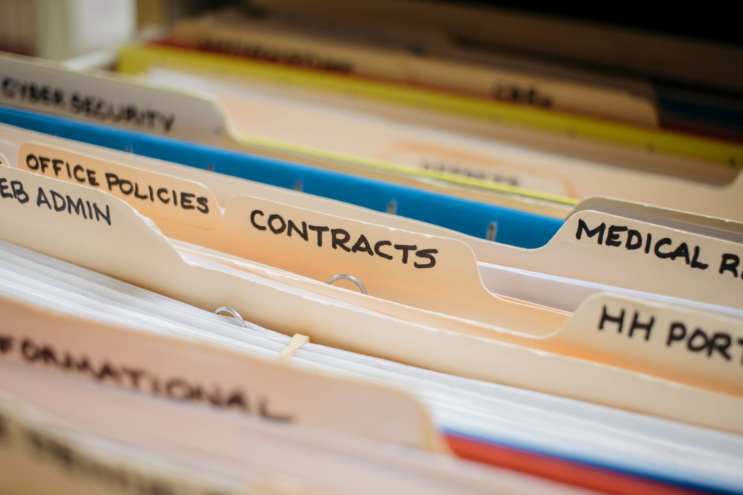 various medical record charts and folders in cabinet and on shelve sorted alphabetically and numerically
